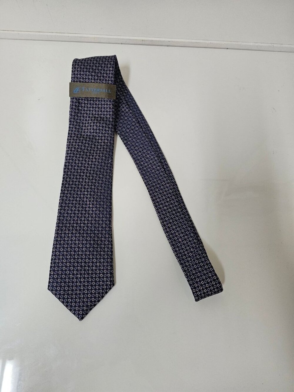 Tattersall London silk necktie with a geometric micro-pattern.